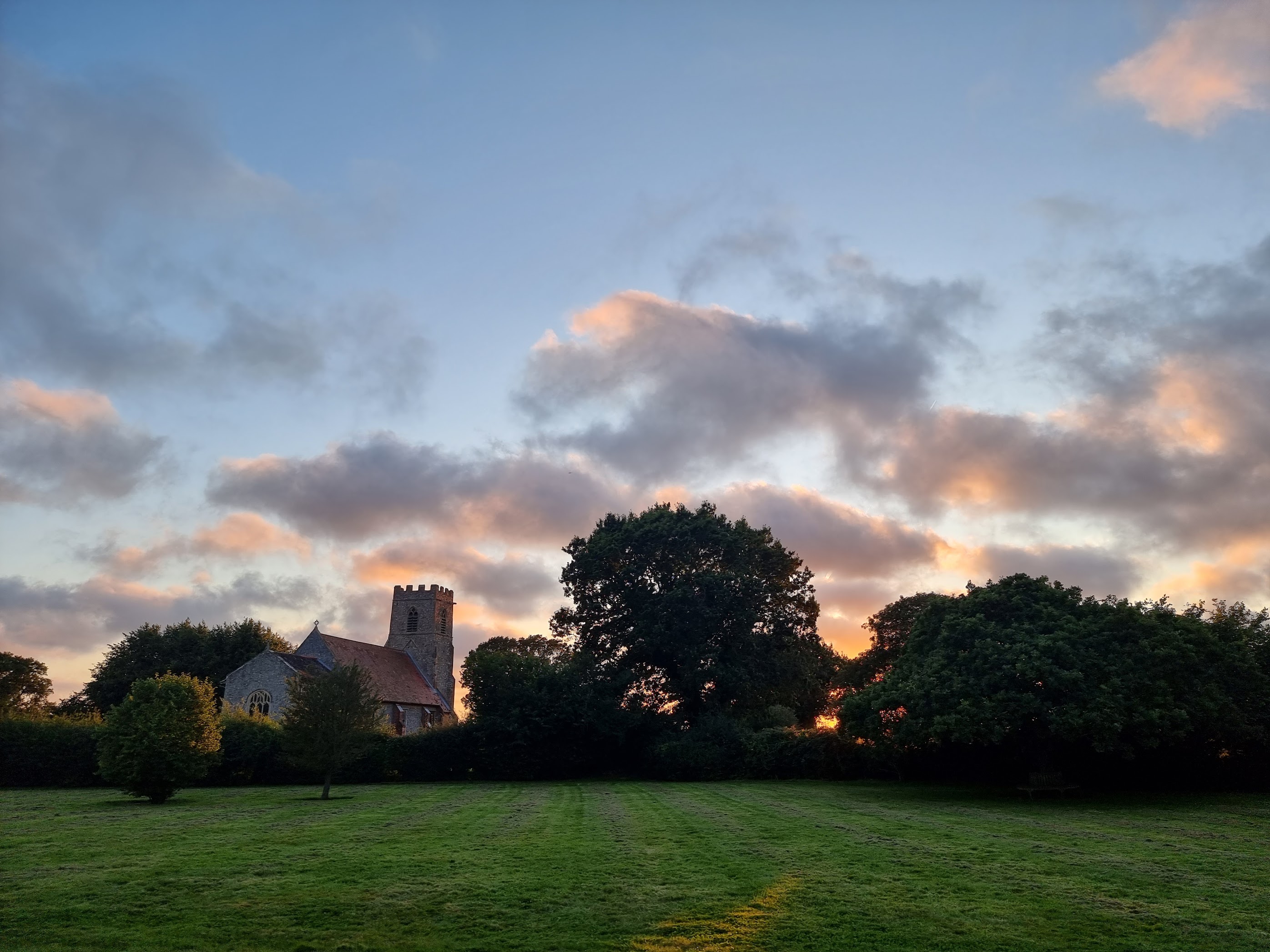 A photo of the church next to our holiday home showing the beautiful summer sunset
